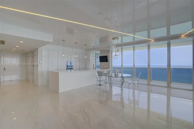 a view of a dining hall with a large window