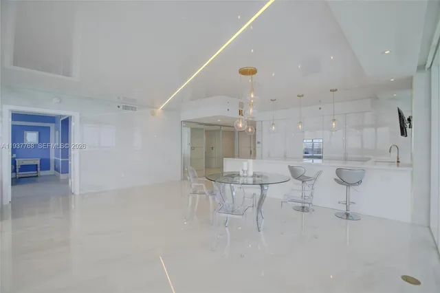 a view of kitchen with furniture and wooden floor