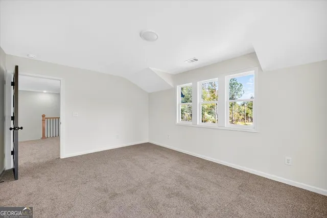 a bathroom with a granite countertop sink a toilet and a bathtub