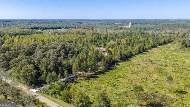 a backyard of a house with lots of green space