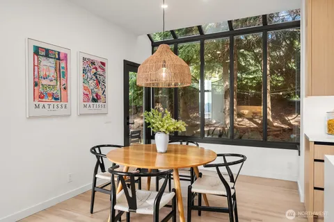 a dining room with furniture and window