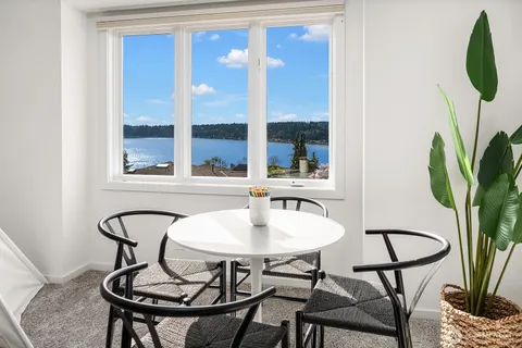 a bathroom with double vanity sinks and a mirror