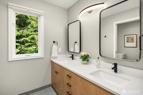 a bedroom with a large bed and a large window