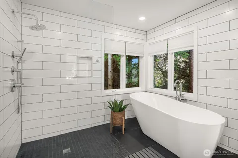 a bathroom with a sink mirror and window