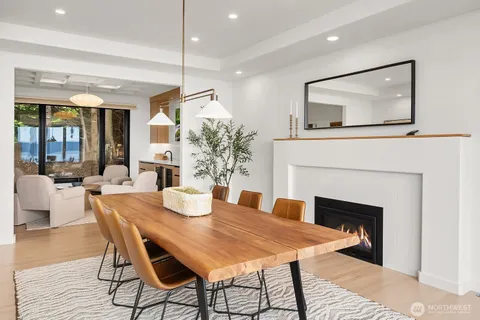 a dining room with furniture and wooden floor