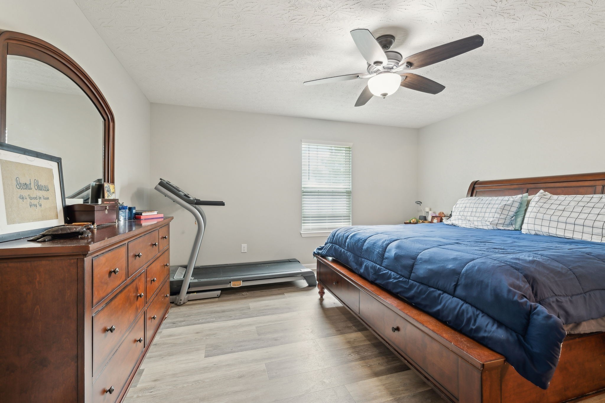 125 Vivian Lane Carthage, TN 37030 - Photo 17 of 29 a bedroom with a bed and a chandelier