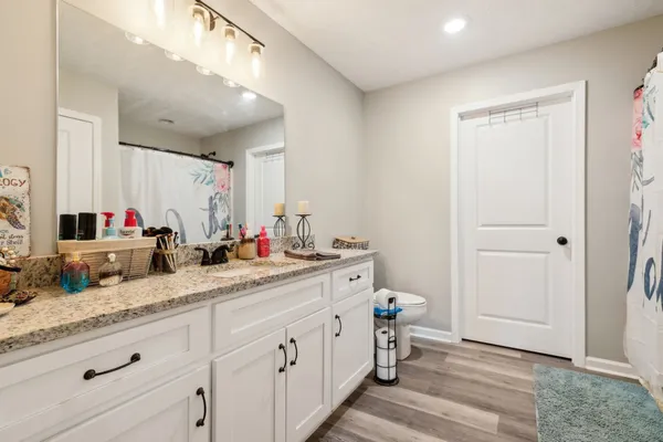 a bedroom with bed and a closet