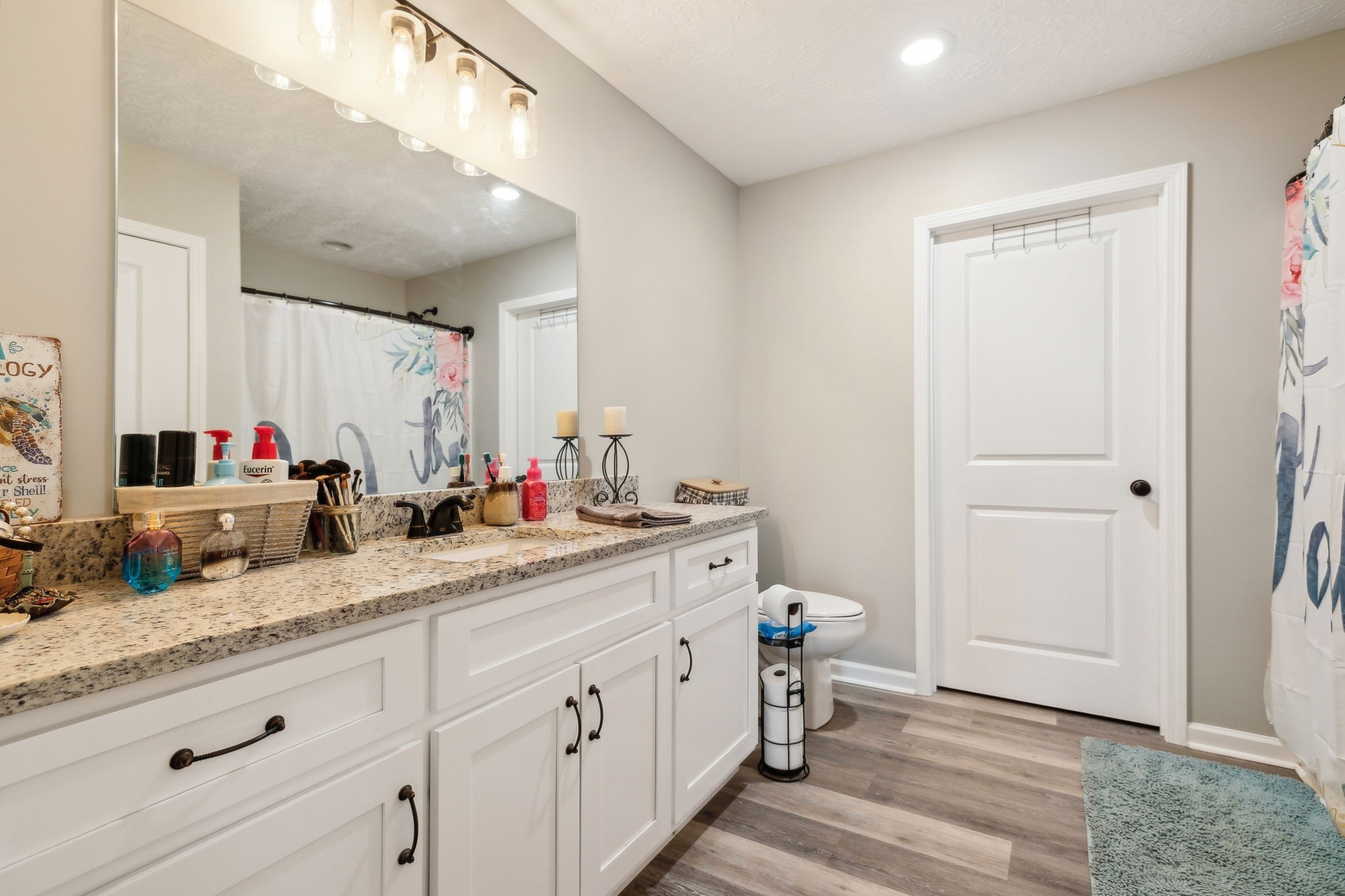125 Vivian Lane Carthage, TN 37030 - Photo 18 of 29 a bathroom with a double vanity sink and a mirror