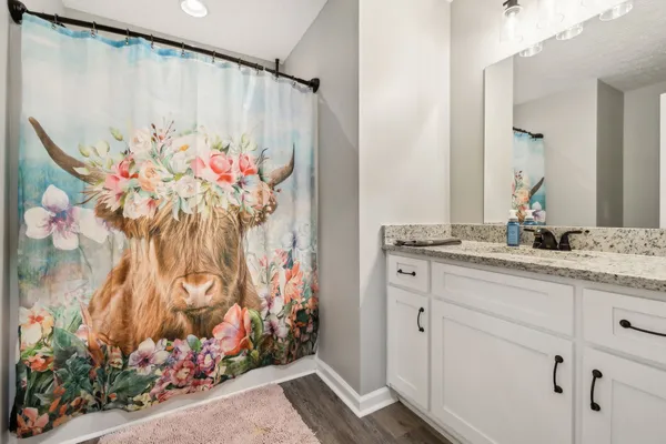 a bedroom with a bed and flat screen tv