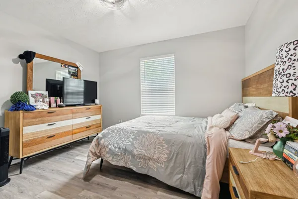 a bedroom with a bed and a table in it