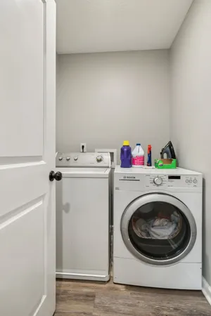 a view of a roof deck with wooden floor and fence
