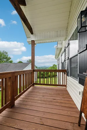 a view of a living room with furniture and a rug