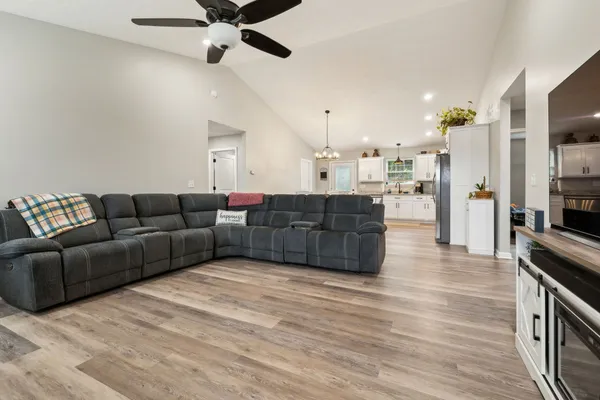 a living room with furniture and a flat screen tv