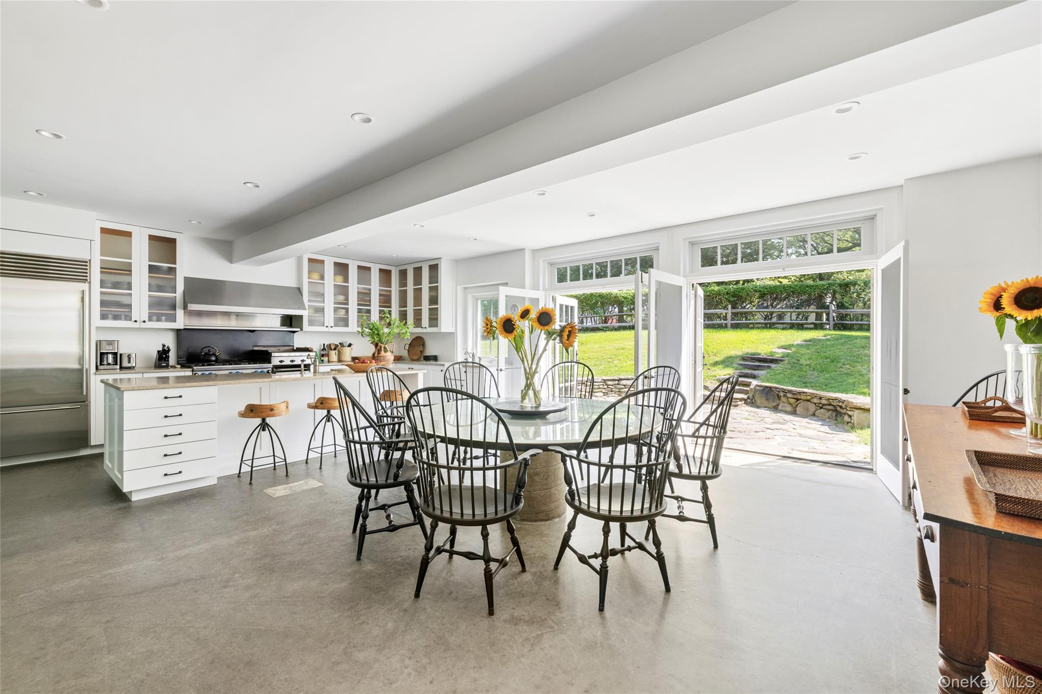 26 Ruxton Road East Hampton, NY 11937 - Photo 13 of 37 Dining space featuring concrete flooring and recessed lighting