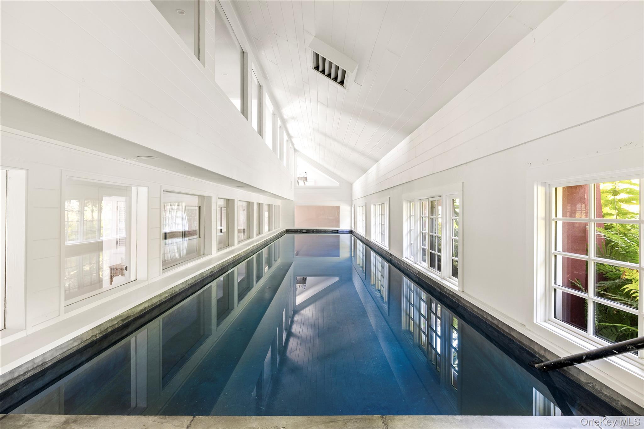 26 Ruxton Road East Hampton, NY 11937 - Photo 15 of 37 2 Pools_Indoor Pool with Interior and Exterior Entrances