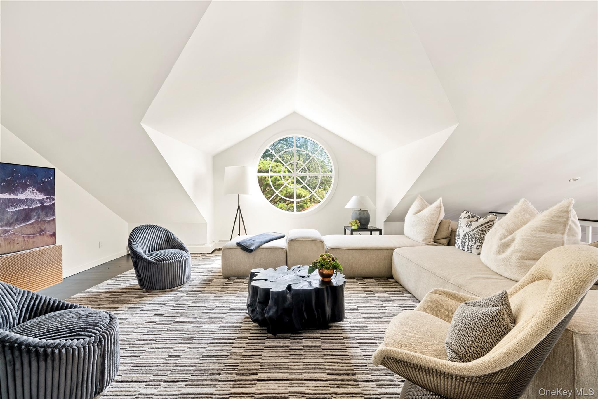 26 Ruxton Road East Hampton, NY 11937 - Photo 20 of 37 Second Floor Media_Living area with vaulted ceiling and wood finished floors