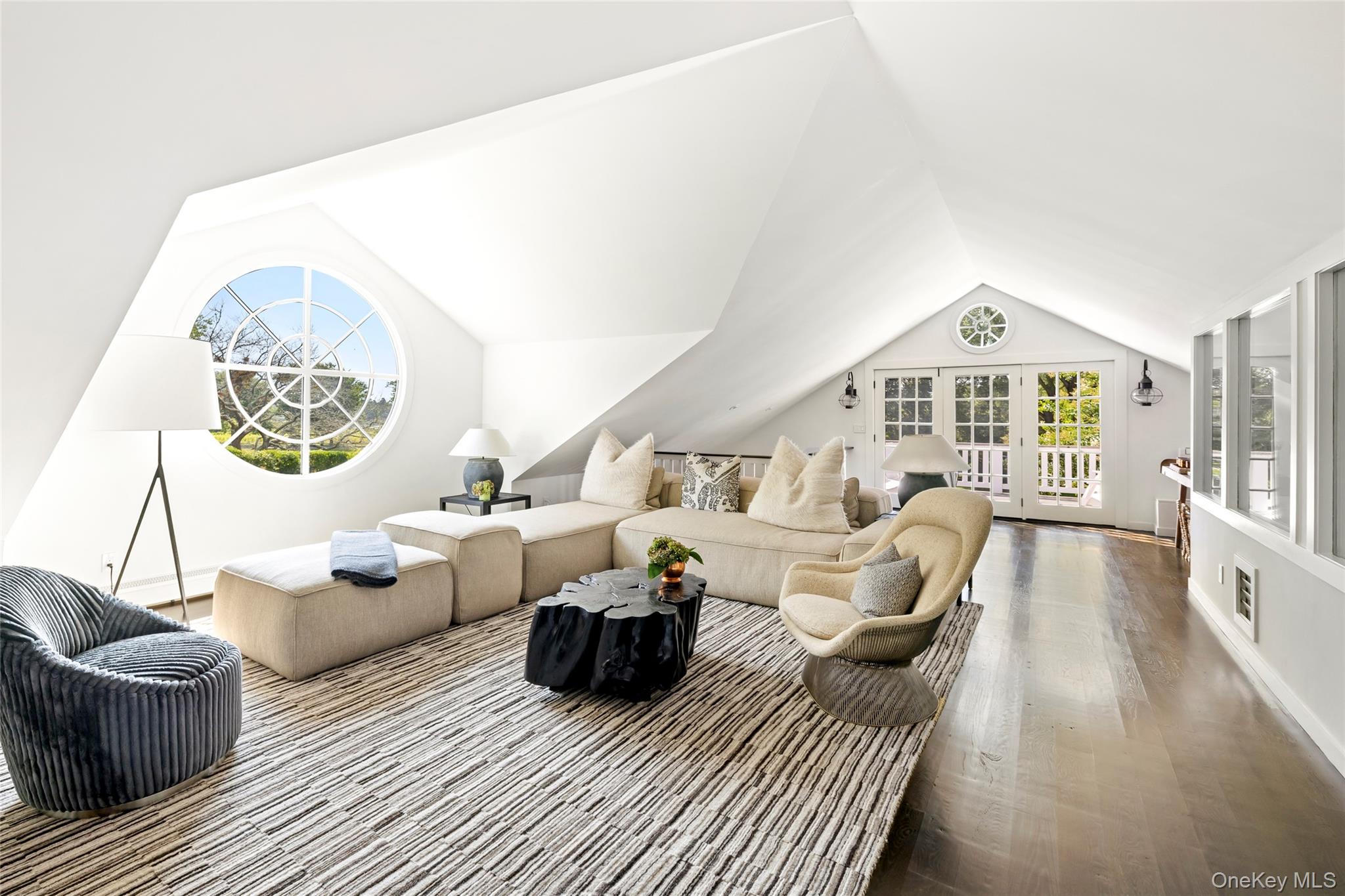 26 Ruxton Road East Hampton, NY 11937 - Photo 22 of 37 Living room featuring vaulted ceiling and wood finished floors
