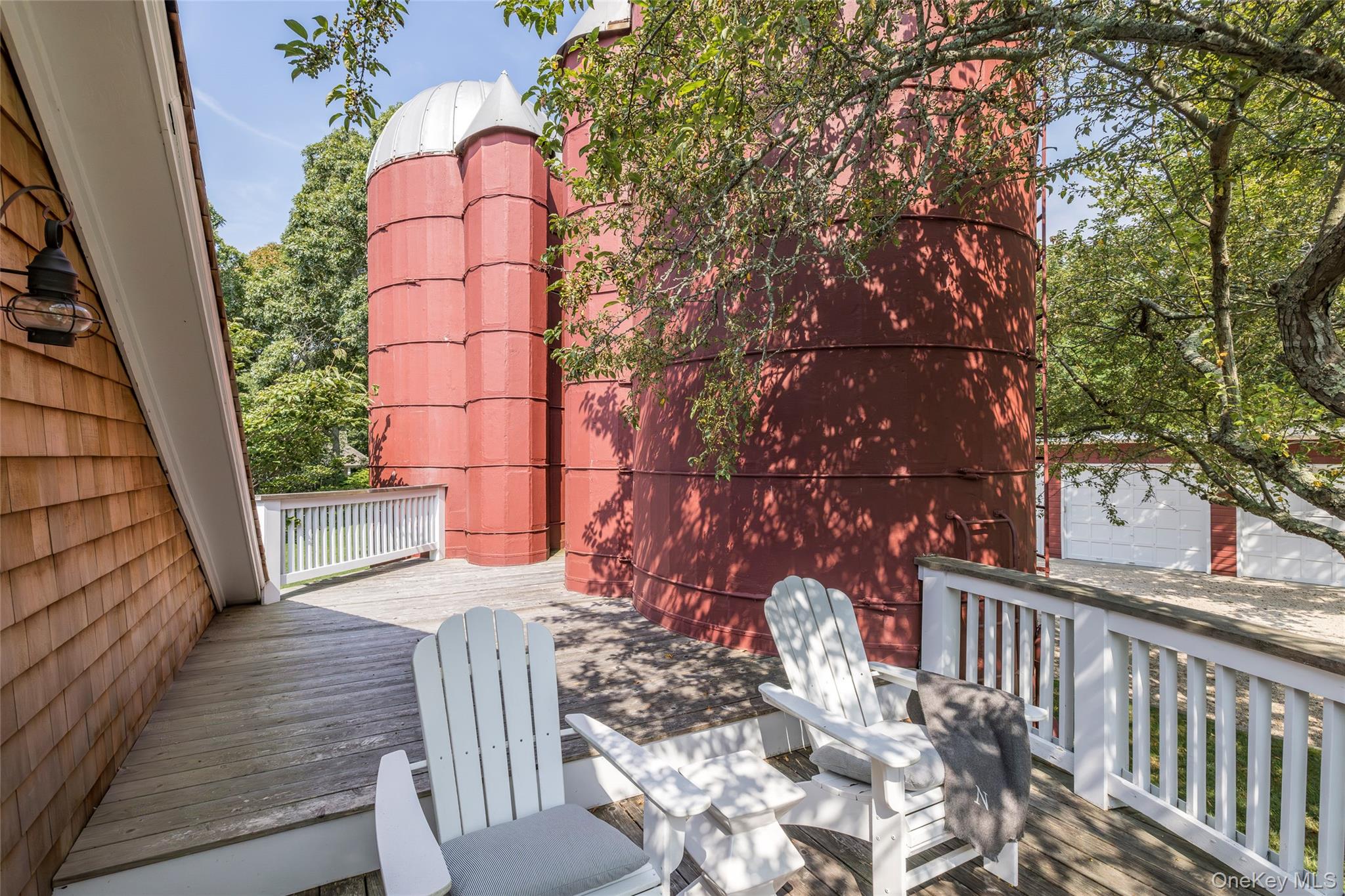 26 Ruxton Road East Hampton, NY 11937 - Photo 27 of 37 Primary Ensuite Sitting Area with Outdoor Silo Shower and Views