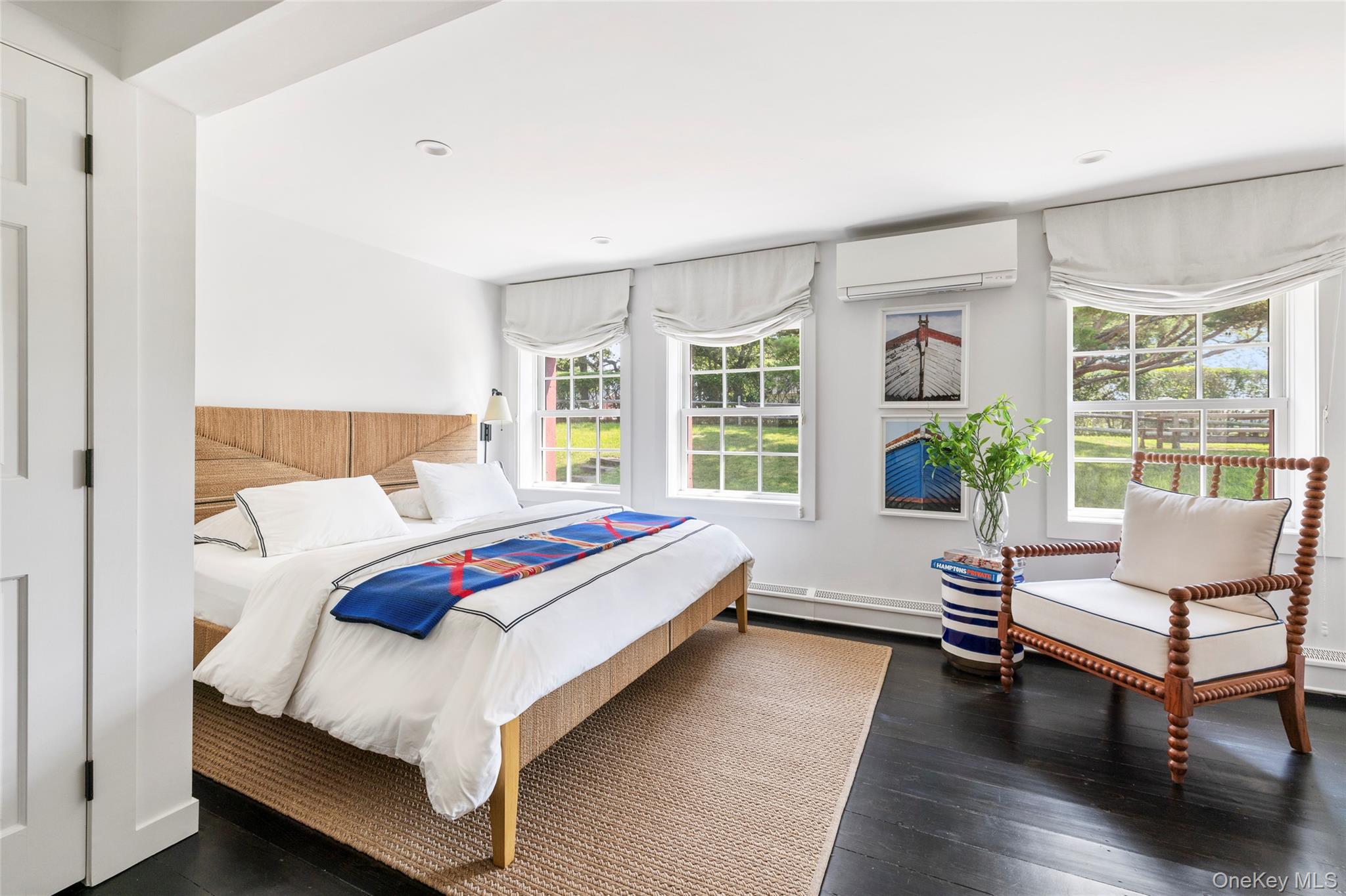 26 Ruxton Road East Hampton, NY 11937 - Photo 28 of 37 1st Bedroom Ensuite featuring dark wood-type flooring, an AC wall unit, recessed lighting, and baseboard heating