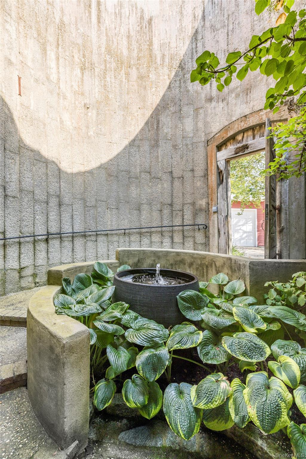 26 Ruxton Road East Hampton, NY 11937 - Photo 9 of 37 Detailed view of a garden pond Entrance