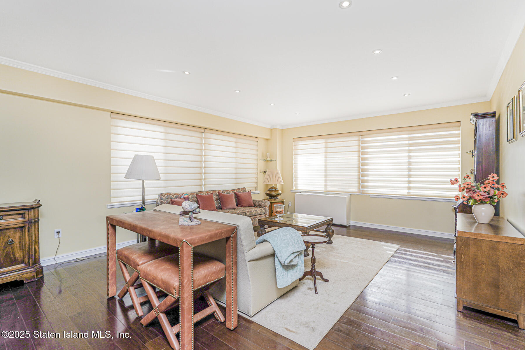 31 Hylan Boulevard, Unit 1B Staten Island, NY 10305 - Photo 13 of 23 a view of a dining room with furniture window and wooden floor