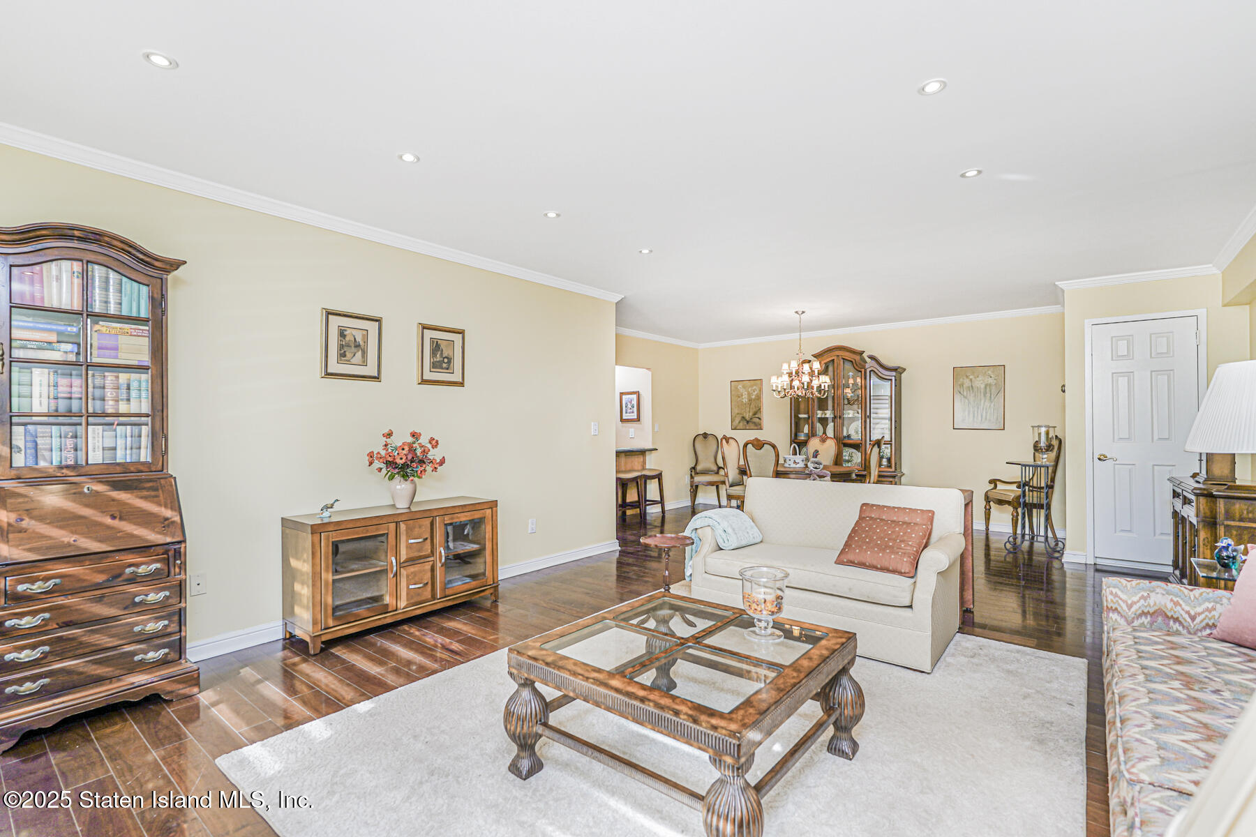 31 Hylan Boulevard, Unit 1B Staten Island, NY 10305 - Photo 18 of 23 a living room with furniture a rug and a table