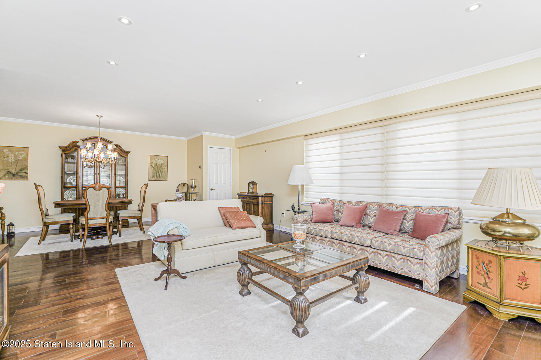 31 Hylan Boulevard, Unit 1B Staten Island, NY 10305 - Photo 19 of 23 a living room with furniture and a wooden floor