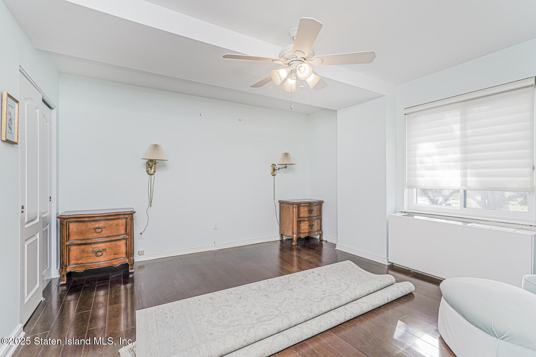 31 Hylan Boulevard, Unit 1B Staten Island, NY 10305 - Photo 20 of 23 a living room with furniture and a window