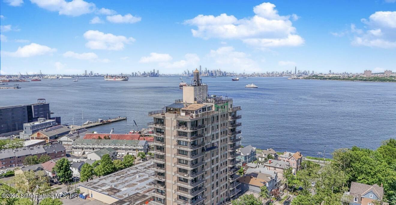 31 Hylan Boulevard, Unit 1B Staten Island, NY 10305 - Photo 3 of 23 a view of a lake with a building in the background