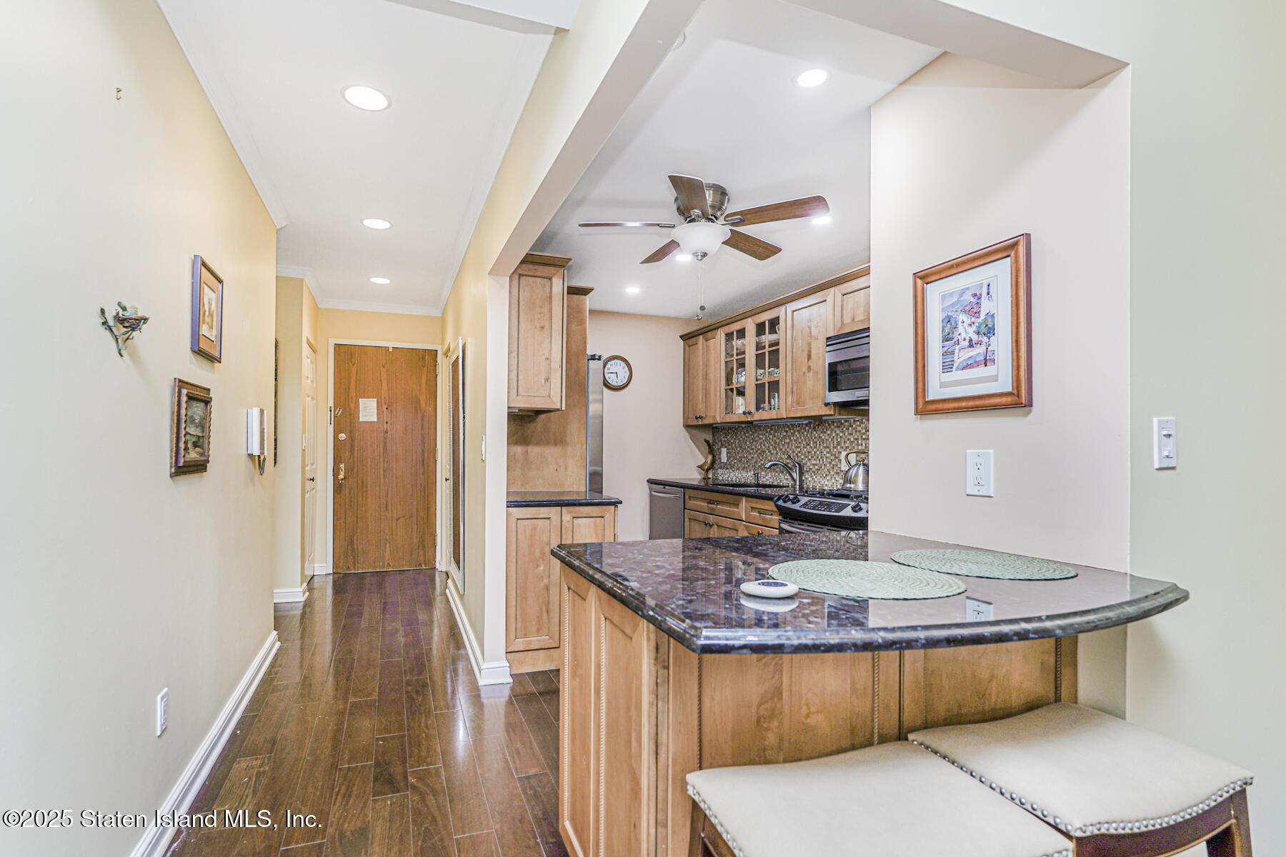 31 Hylan Boulevard, Unit 1B Staten Island, NY 10305 - Photo 6 of 23 a dining hall with stainless steel appliances granite countertop a stove and a sink