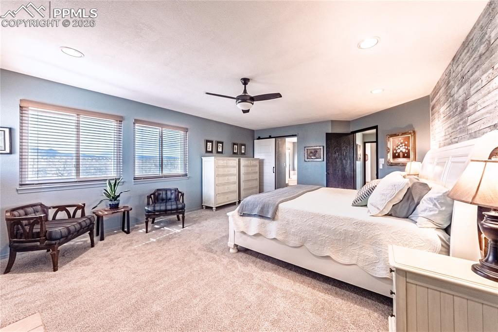 9110 Link Road Fountain, CO 80817 - Photo 20 of 47 a bedroom with bed and glass windows