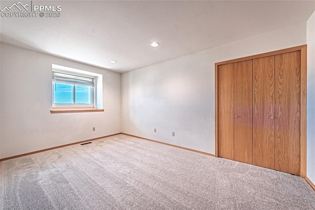 9110 Link Road Fountain, CO 80817 - Photo 24 of 47 an empty room with windows