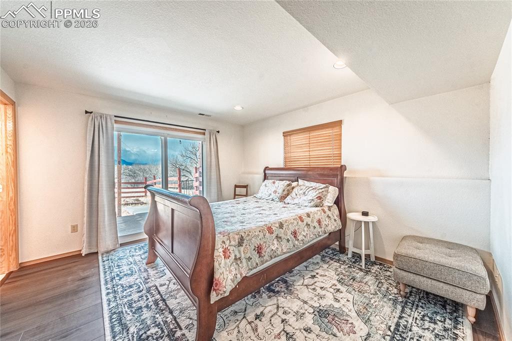 9110 Link Road Fountain, CO 80817 - Photo 31 of 47 a bed sitting in a bedroom next to a window