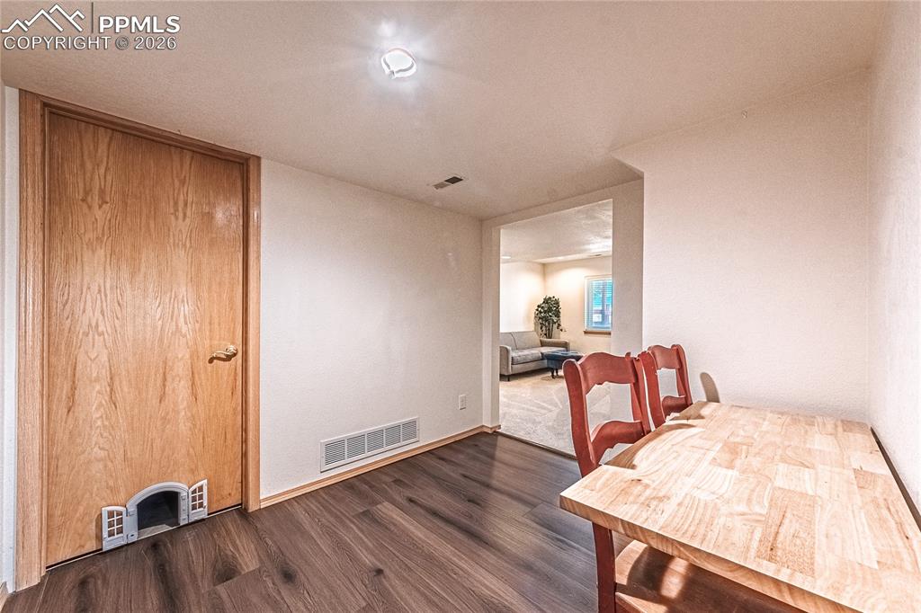 9110 Link Road Fountain, CO 80817 - Photo 33 of 47 a living room with furniture and a wooden floor