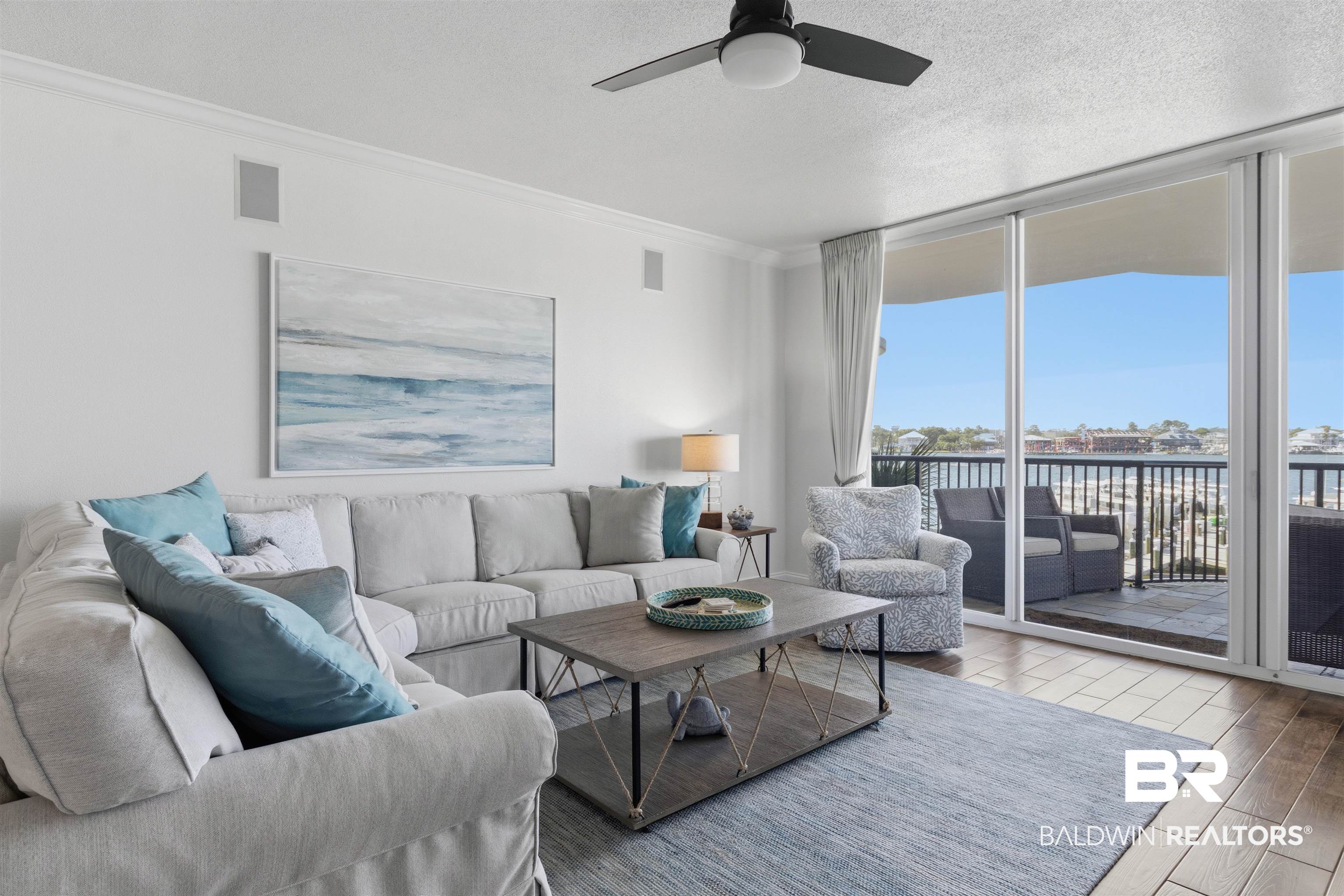 3564 Bayou Road, Unit 203 Orange Beach, AL 36561 - Photo 19 of 53 Expansive sliding glass doors opening to a balcony with water views