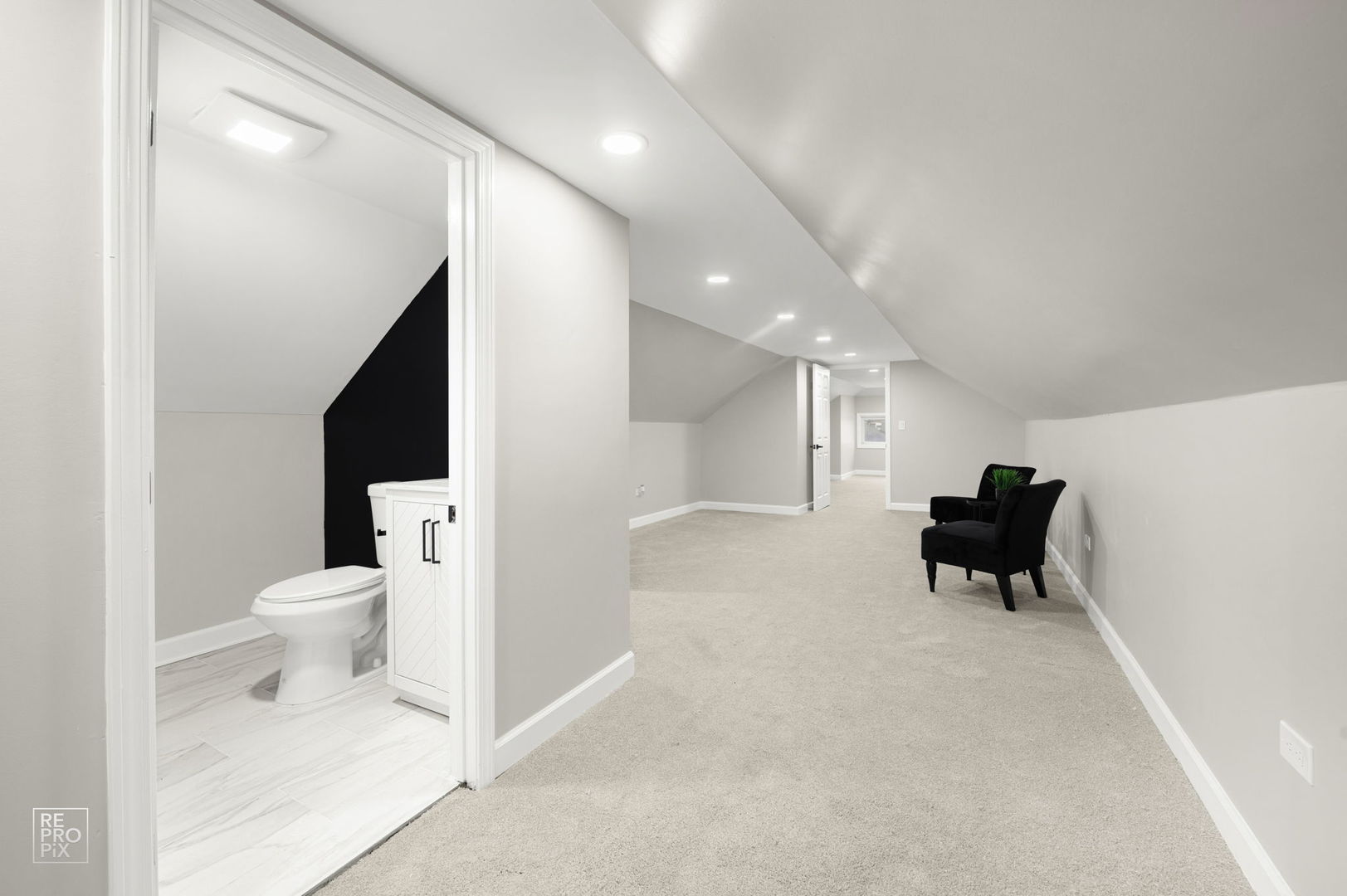 7425 South Vernon Avenue Chicago, IL 60619 - Photo 15 of 15 a living room with furniture and a toilet