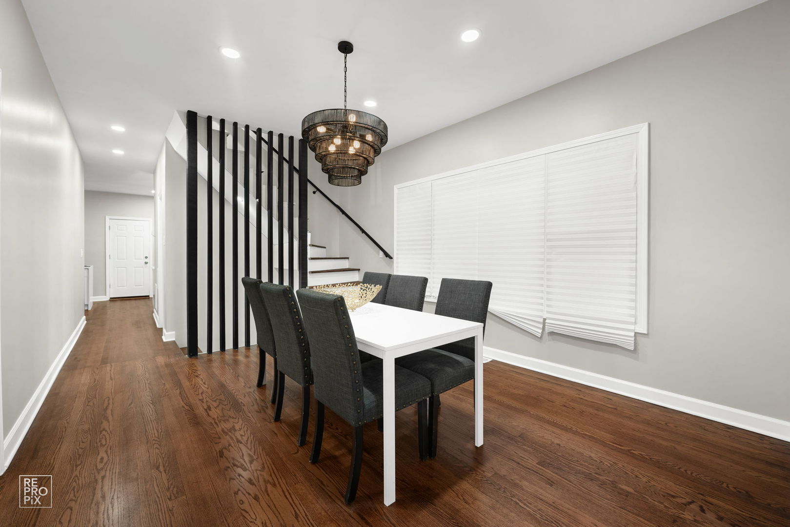 7425 South Vernon Avenue Chicago, IL 60619 - Photo 5 of 15 a view of a room with wooden floor and furniture