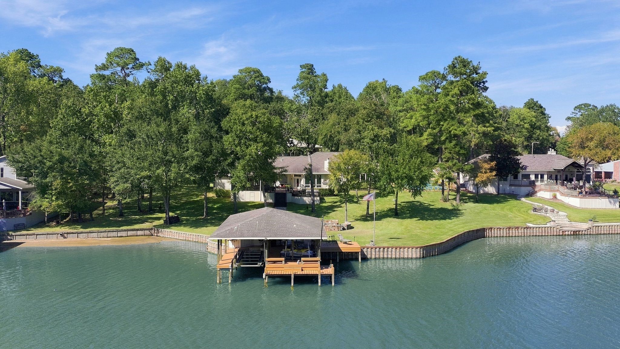 20341 Bay Hill Road Point Blank, TX 77364 - Photo 50 of 50 Sweeping lake views with a covered boat dock and scenic shoreline.