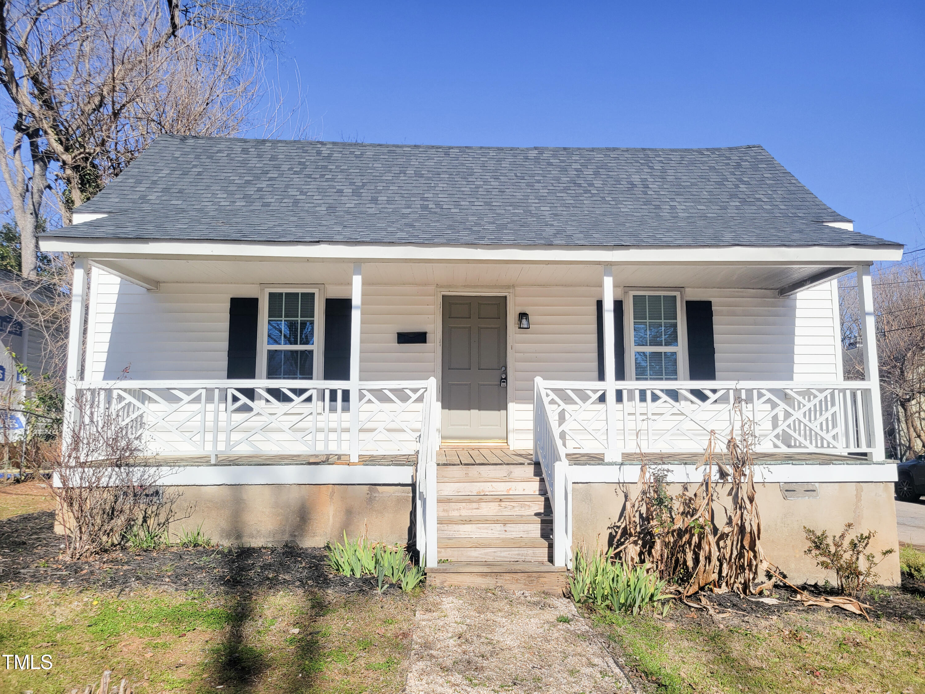 1611 Cross Street Raleigh, NC 27610 - Photo 1 of 22 a front view of a house with a yard