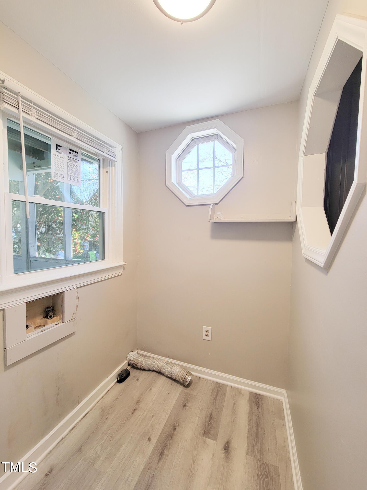 1611 Cross Street Raleigh, NC 27610 - Photo 12 of 22 an empty room with windows