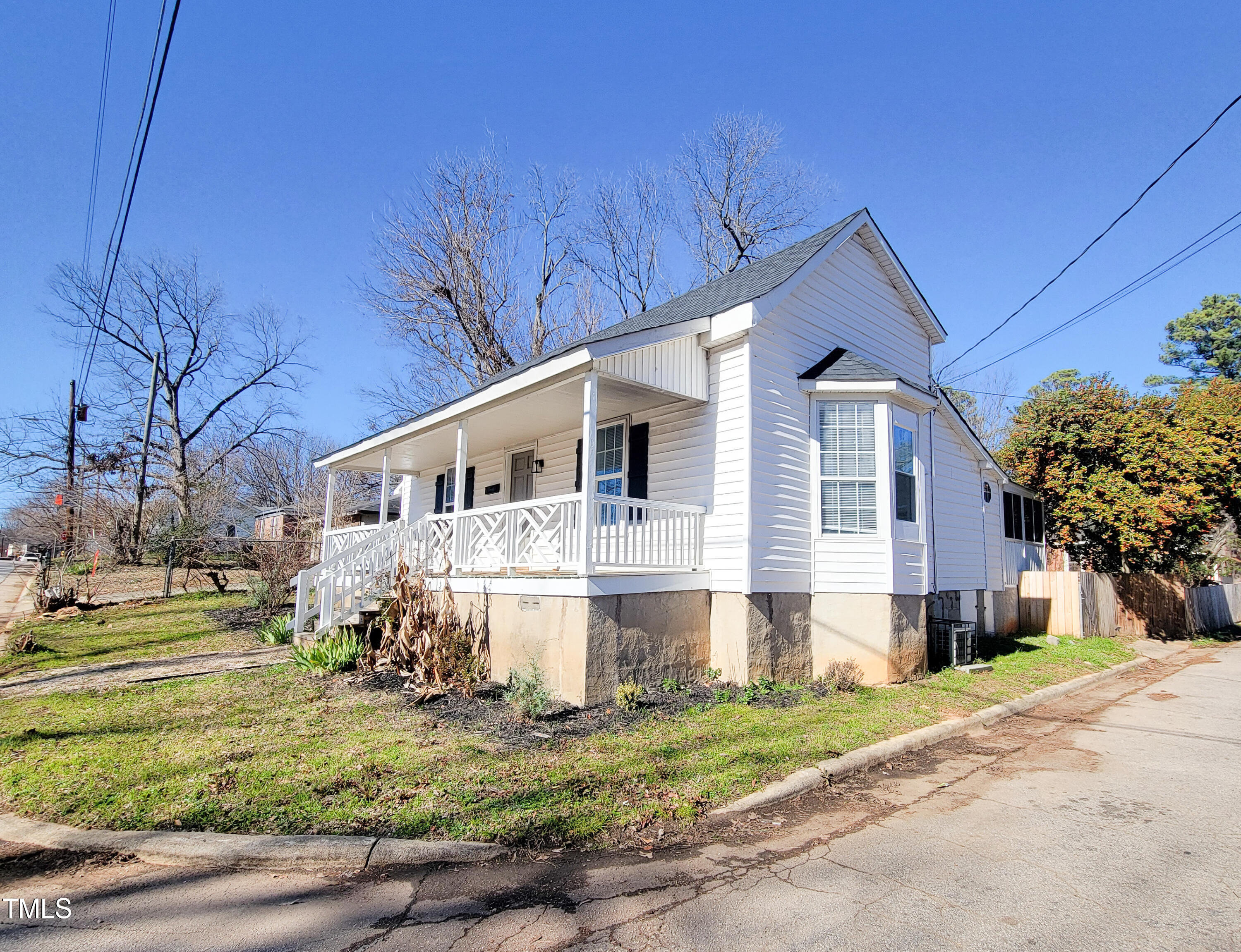 1611 Cross Street Raleigh, NC 27610 - Photo 3 of 22 a front view of a house with a yard