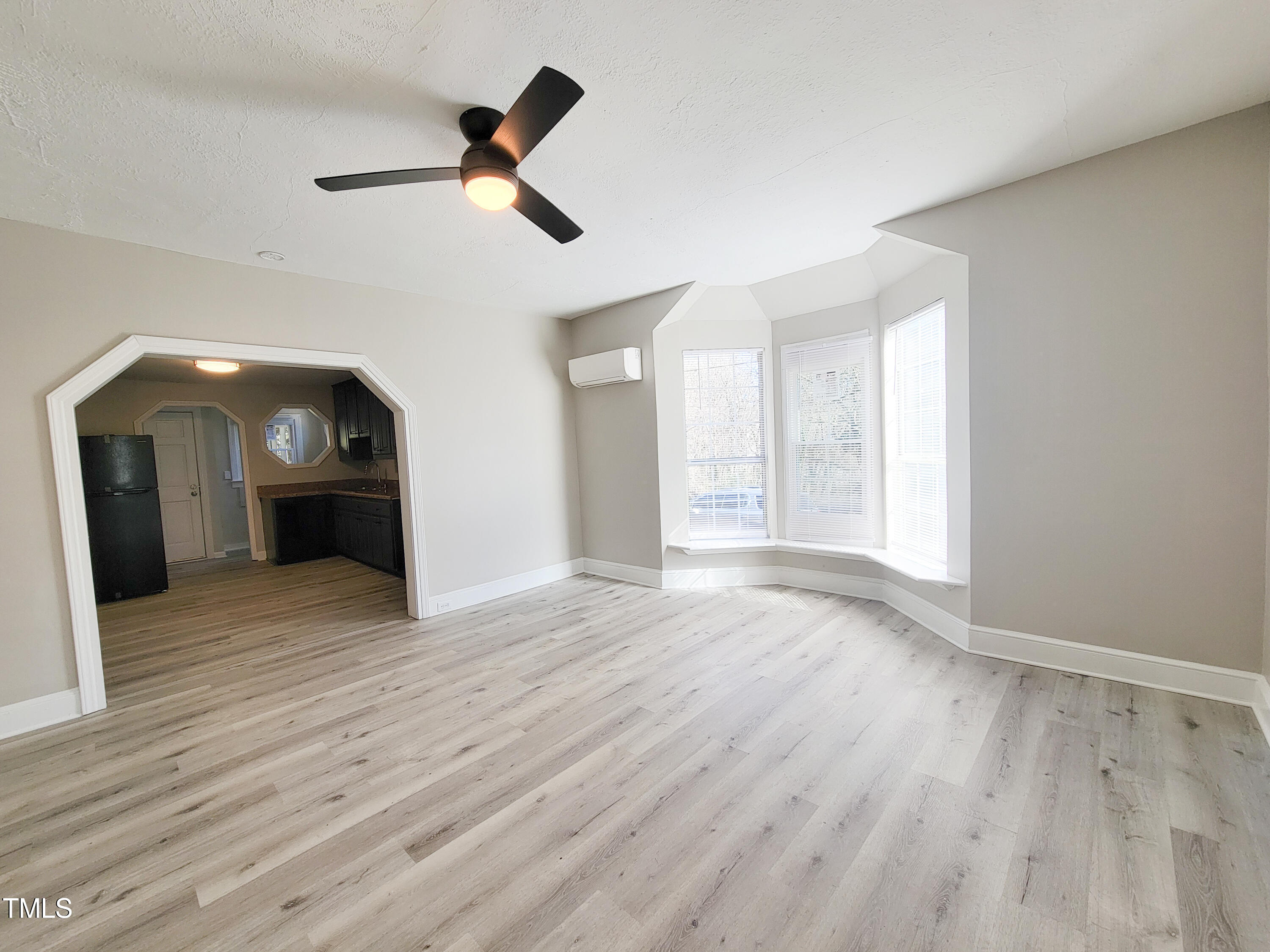 1611 Cross Street Raleigh, NC 27610 - Photo 5 of 22 a view of empty room with wooden floor and ceiling fan
