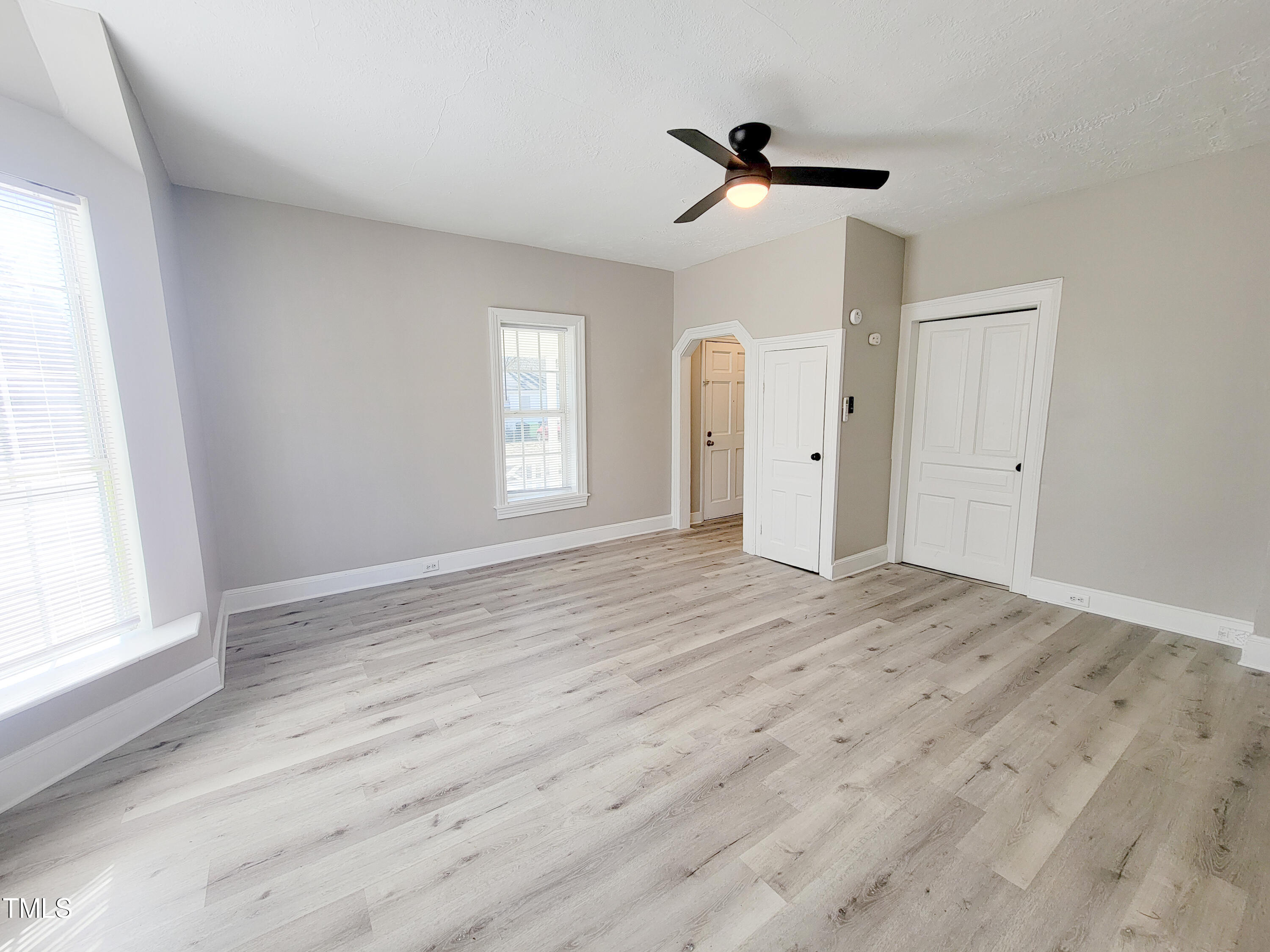 1611 Cross Street Raleigh, NC 27610 - Photo 6 of 22 a view of empty room with wooden floor and fan