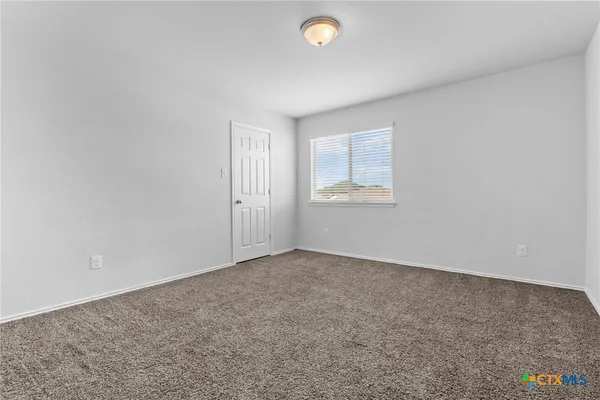 a view of a balcony with a ceiling fan