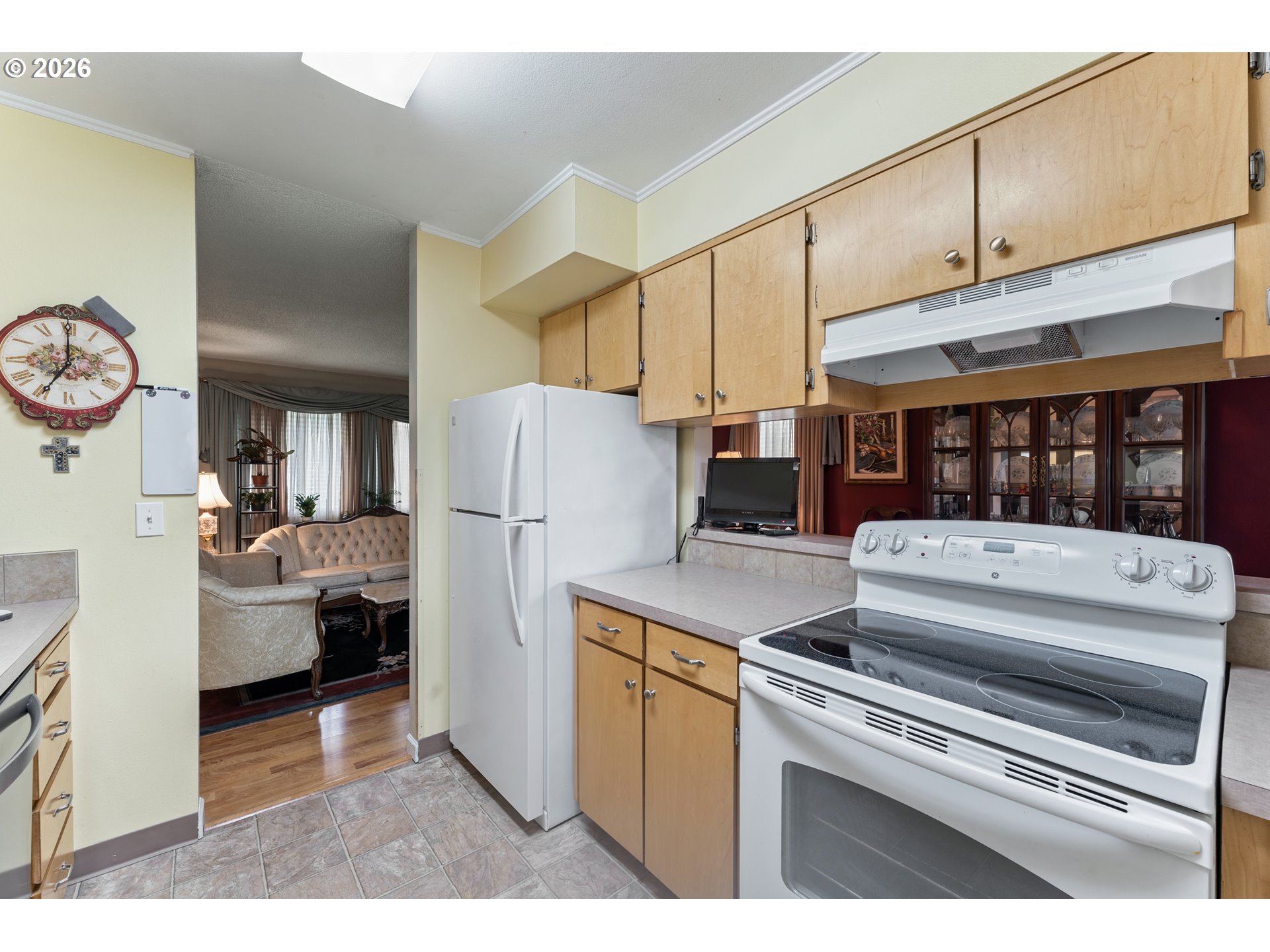 11341 Southwest Springwood Drive Portland, OR 97223 - Photo 12 of 26 a kitchen with a refrigerator and a stove top oven