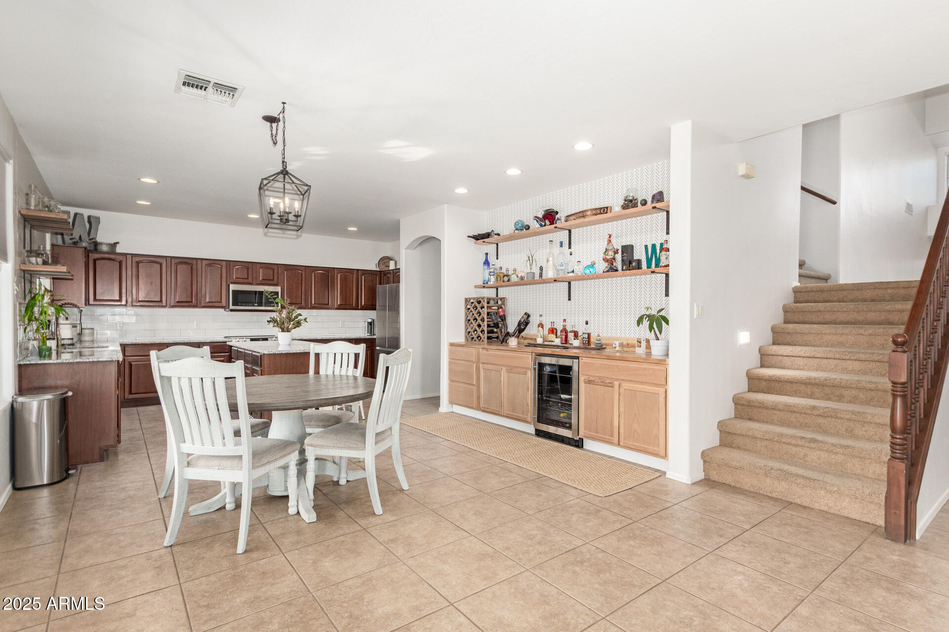 6003 West Oberlin Way Phoenix, AZ 85083 - Photo 14 of 69 a kitchen with stainless steel appliances kitchen island granite countertop a sink and cabinets