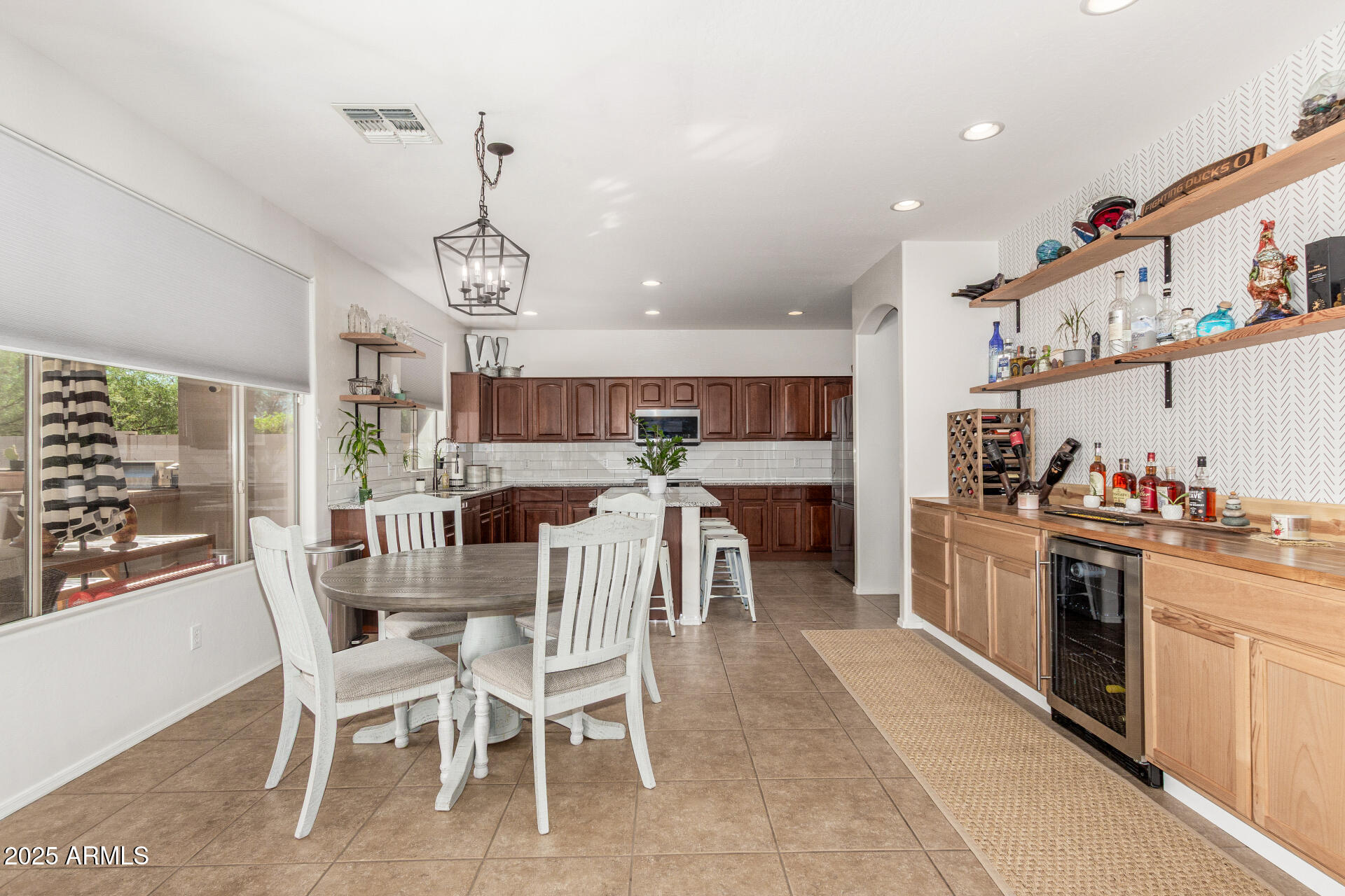 6003 West Oberlin Way Phoenix, AZ 85083 - Photo 15 of 69 a view of a dining room with furniture window and wooden floor