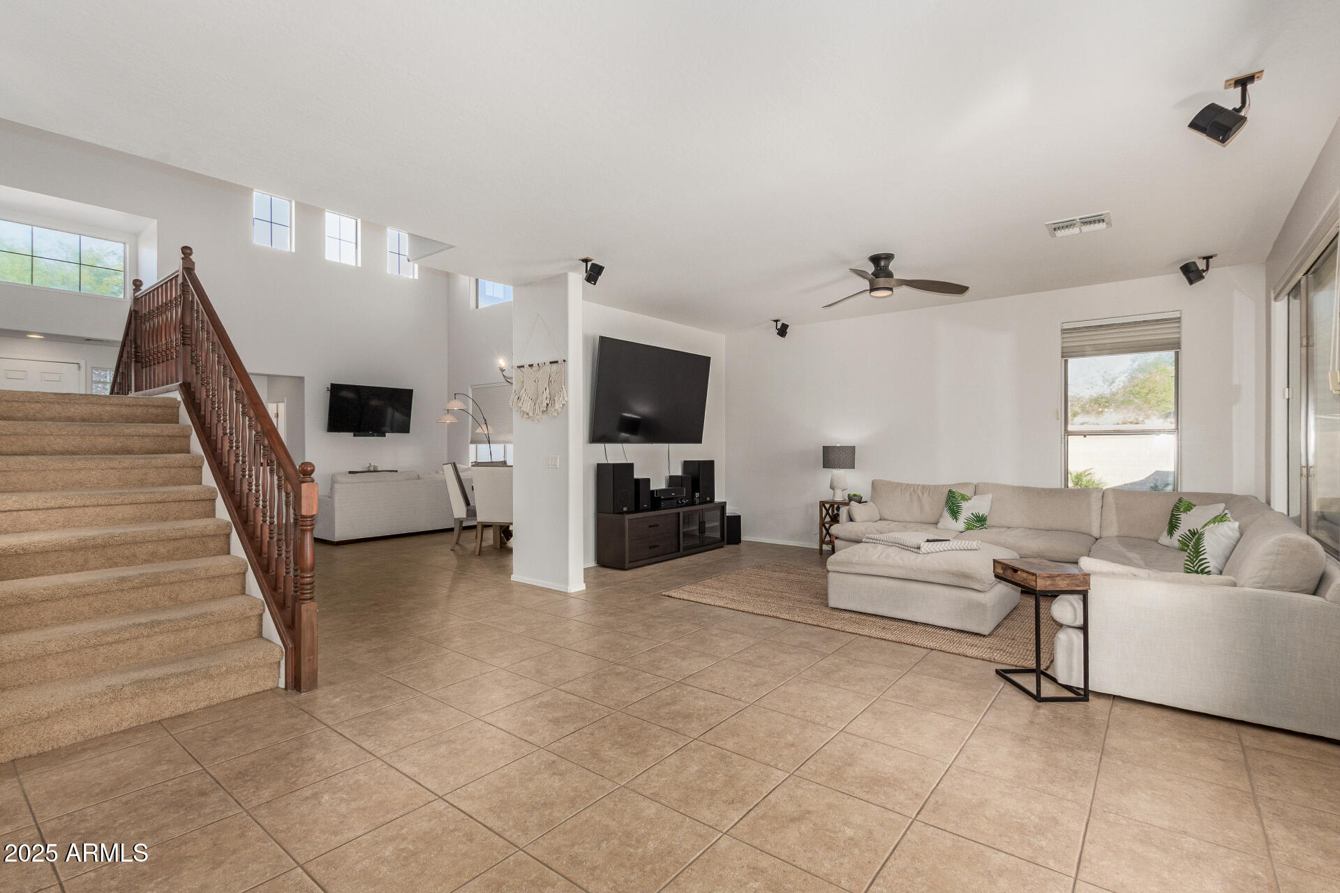 6003 West Oberlin Way Phoenix, AZ 85083 - Photo 16 of 69 a living room with furniture and a flat screen tv