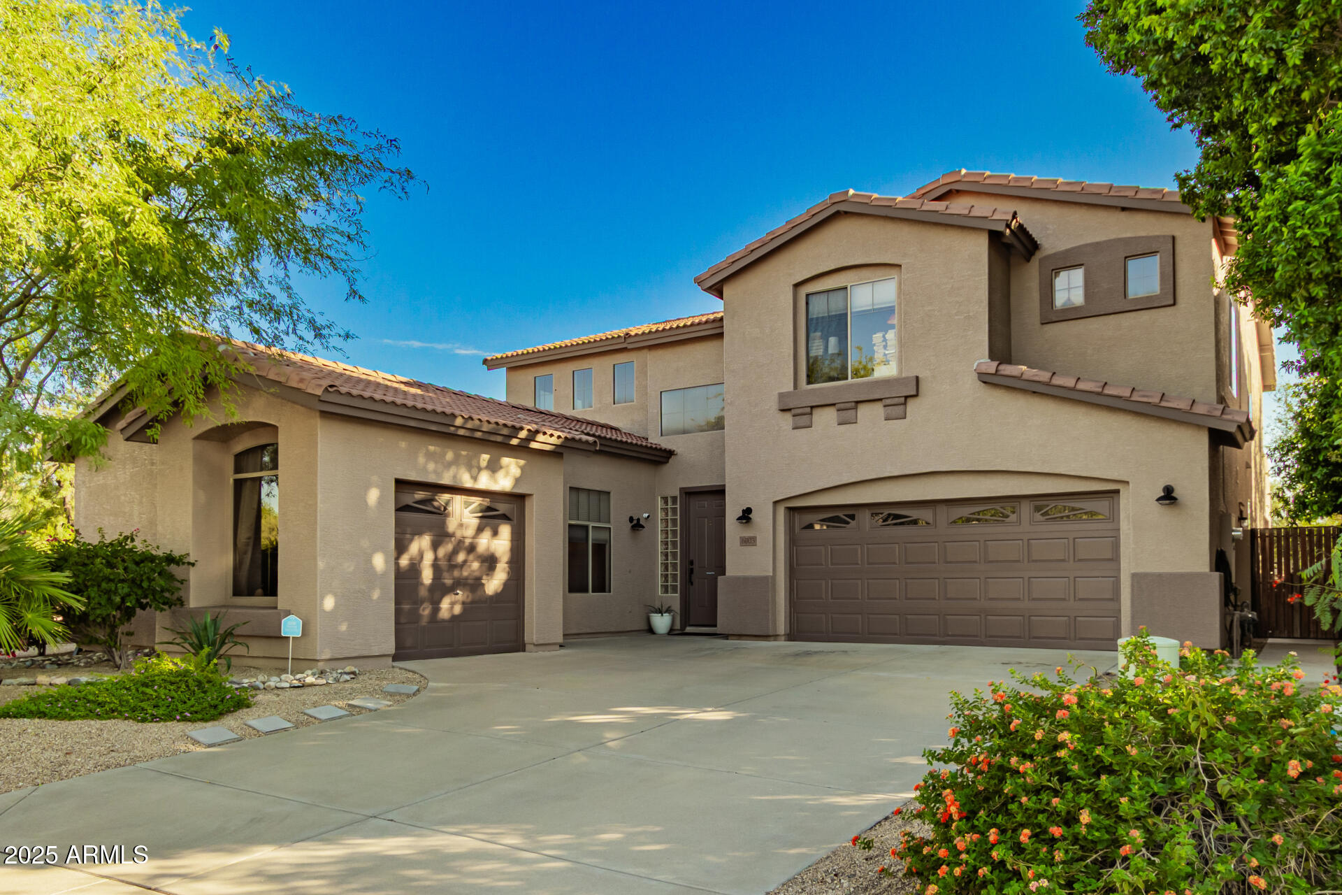 6003 West Oberlin Way Phoenix, AZ 85083 - Photo 2 of 69 a front view of a house with a garage