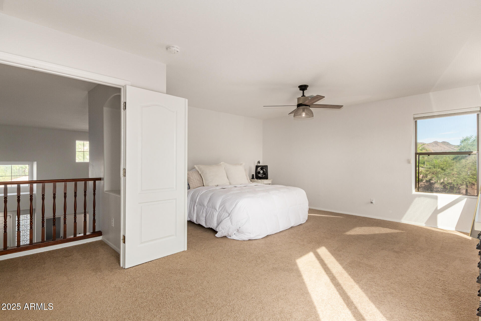 6003 West Oberlin Way Phoenix, AZ 85083 - Photo 22 of 69 a bedroom with a bed and a large window
